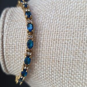 Avon Vintage Synthetic Blue Topaz December Birthstone Tennis Bracelet Goldtone
